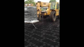 SkyTrak Driving Over GEOTERRA® GTO Portable Mat System