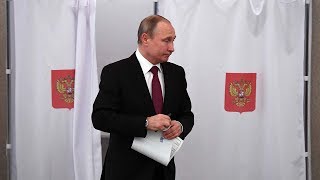 Incumbent Vladimir Putin casts vote in Russia's presidential poll