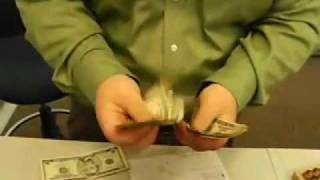 Bank Teller Counting Cash