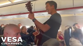 Group of airplane passengers sing Christian music to the entire cabin