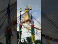 Serenity and Spirituality: Waving Prayers Flags at Boudhanath Temple, Kathmandu