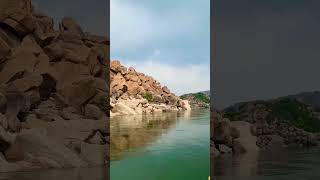 Enjoying the coracle ride with scenic view on Tungabhadra river, Hampi