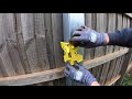 reinforcing a wooden fence with a steel post