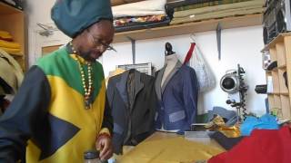 Ras Nyto in his work shop sewing