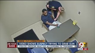 Murder suspect grabs for officer's gun