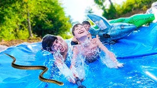 EPiC BACKYARD WATERSLIDE with SNAKES!?! 💦