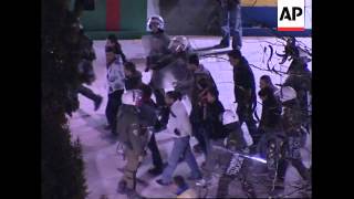 WRAP Running battles between youths and riot police, arrests; ADDS more