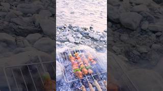 Grilling Lamb Skewers by the Riverside 🍖🍖 #food #cooking  #meat #grill #skewers #youtubeshorts