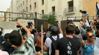 Lebanese protesters force open gate leading to parliament amid Macron visit | AFP