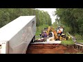 truck plunges off of washed out road into floodwaters