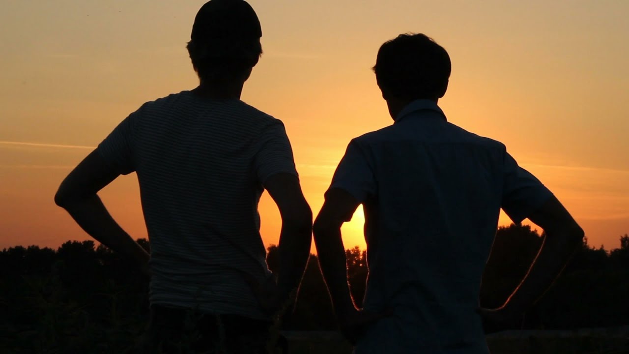 Friendship, Teamwork, Two Male Best Friends Enjoying Dusk.. Stock ...