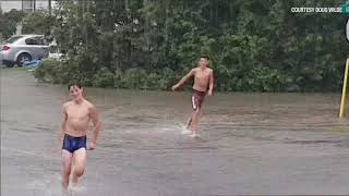 RAW: Storm turns street into swimming hole