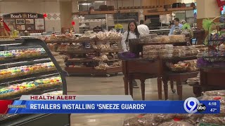 Retailers installing 'sneeze guards'