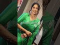 actress regina dressed in a beautiful green saree enters at district150 for democratic sangha event.