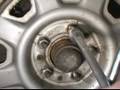 How to Replace Your Shocks : How to Spin Off Lug Nuts