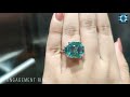 emerald and trapezoid moissanite three stone engagement ring