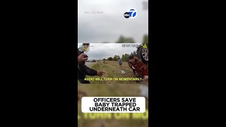 Baby pulled from underneath car in dramatic rescue