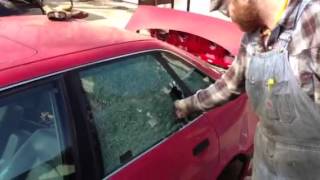 Breaking a car window with a center punch