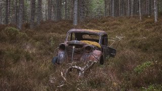 Abandoned 1930s Opel Olympia in a Scottish Forest.