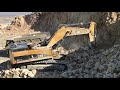 caterpillar 385c excavator loading rocks on dumpers labrianidis sa