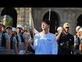 TORCHBEARER JIN Carries the Olympic Flame at 2024 PARIS Summer OLYMPICS