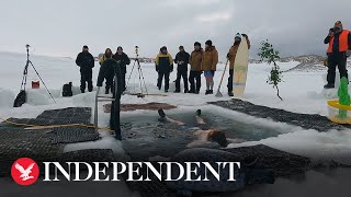 Antarctica explorers take plunge in sub-zero water to celebrate winter solstice