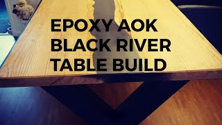 Black Aok epoxy river table