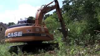 Excavator Clearing land