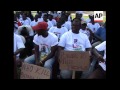 Supporters and protesters welcome Mugabe at AU summit
