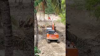 Amazing Excavator uprooting trees