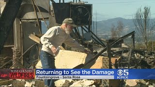 FIRE EVACUEES RETURN HOME:  Residents return to the fire-ravaged Fountain Grove neighborhood