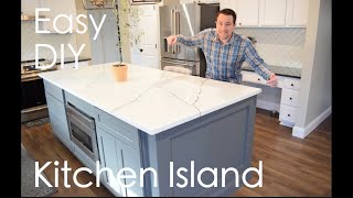 Easy DIY Kitchen Island with seating, storage, microwave under cabinet (marble quartz countertop)