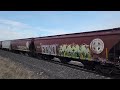 bnsf 7411 leads a southbound grain train with another fakebonnet and a sweet h2 duo on the rear