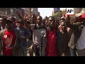 MDC supporters marching in Harare in wake of news that rival Zanu-PF has won majority