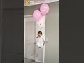 Baby flying from helium balloon