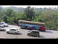 heavy load lorry ksrtc and private bus turning hairpinbend. thamarassery ghat. kerala india 4k