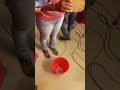 Zion's Gate Church members trying to break the tile with the bulb