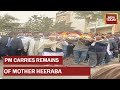 PM Narendra Modi Carries The Mortal Remains Of His Late Mother Heeraba