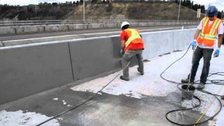 Sack and rub finish - bridge concrete barriers.AVI