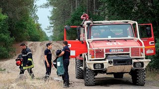 Investigators in France sweep the remains of wildfires to find clues of their origin