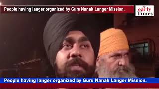 People having langer organized by Guru Nanak Langer Mission