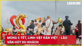 Mùng 5 Tết, linh vật rắn Việt - Lào vẫn hút du khách | Báo Lao Động