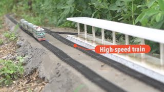 College student built miniature high-speed train in a vegetable plot