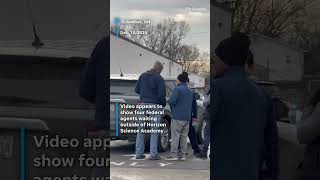 Federal agents waiting outside of Columbus school