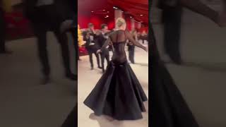 Lady Gaga helps a falling man at the Oscars 2023