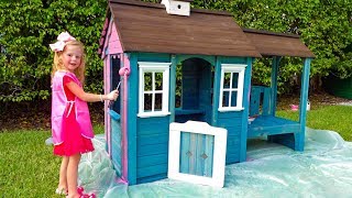 Stacy paints a new playhouses