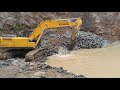 hyundai excavator loading in a quarry washing rock