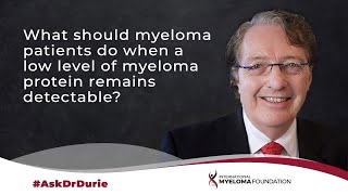 What should myeloma patients do when a low level of myeloma protein remains detectable?