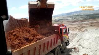 KOMATSU PC 750SE fighting with mud and rocks