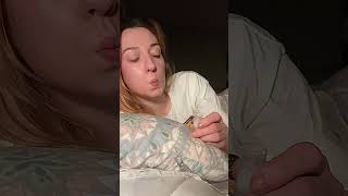 Girl hocking spit into a vial